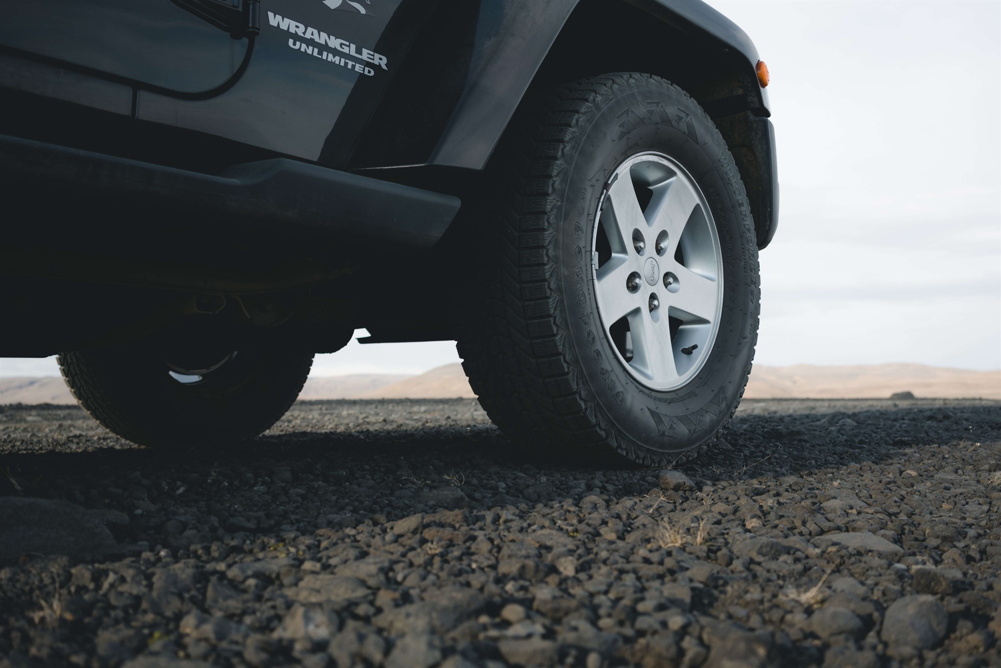 Vehicle tyre on a gravel road in Iceland